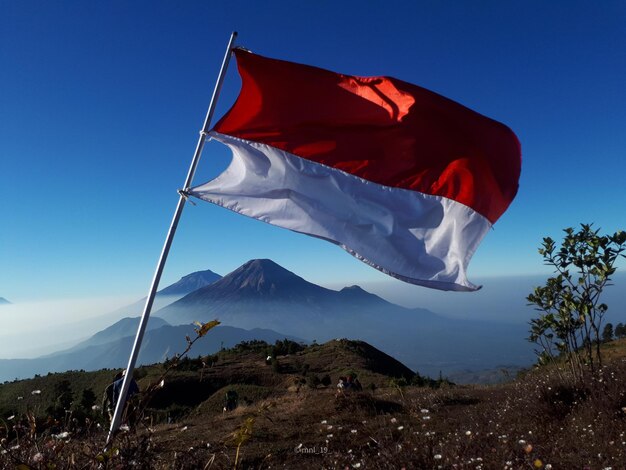 Indonesian flag flying over mount prau
