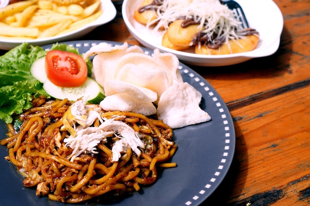 indonesian food - Fried noodles topped with minced meat