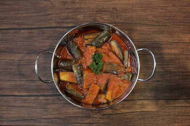 Indonesian Food, Terong Balado, with spicy chili sauce, garnish with parsley. 