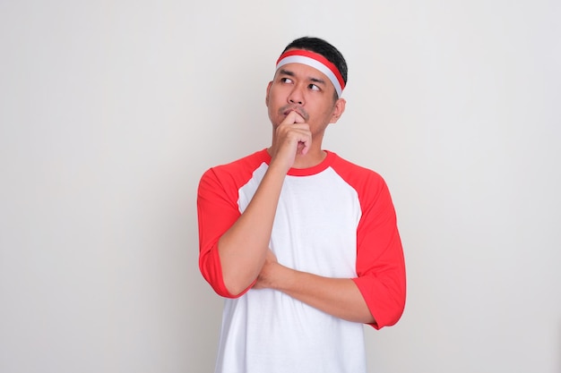 Indonesian man looking to the right side while thinking about something