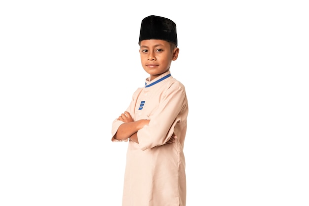 Indonesian Moslem boy wearing islami clothes isolated on white background