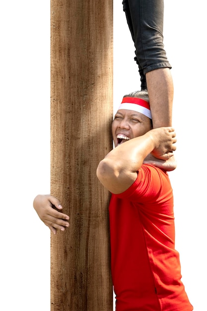 Indonesian people celebrate Indonesian independence day on 17 August with a climb competition isolated over white background