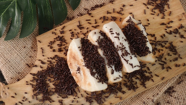 Indonesian snack pancong sprinkled with sugar or sprinkles.