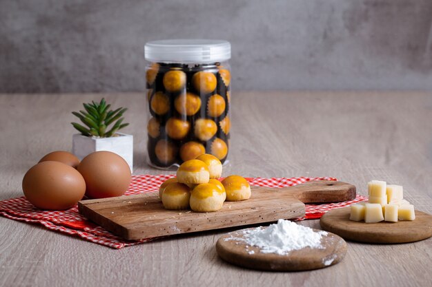 Indonesian Traditional Cake Nastar Cake on a jar and wooden Tray