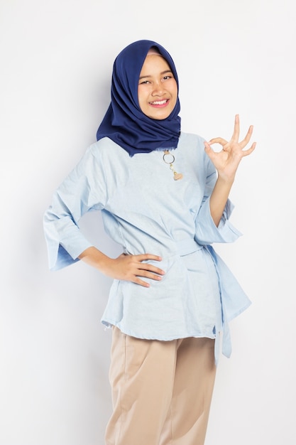 Indonesian Woman in Hijab Laughing with Okay Pose