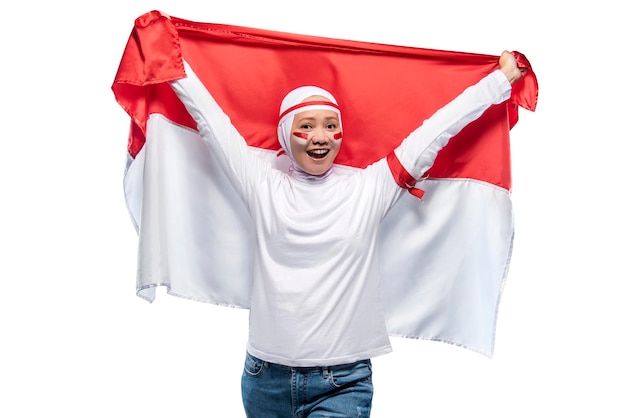 Indonesian women celebrate Indonesian independence day on 17 August by holding the Indonesian flag