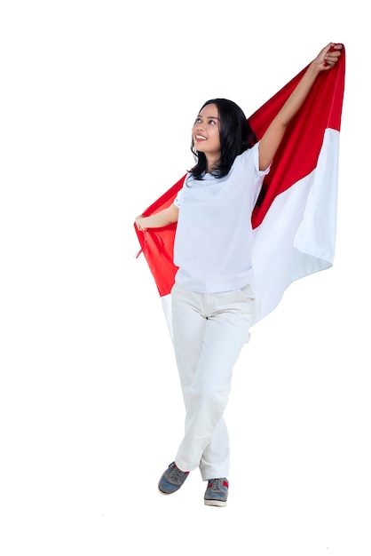 Indonesian women celebrate Indonesian independence day on 17 August by holding the Indonesian flag