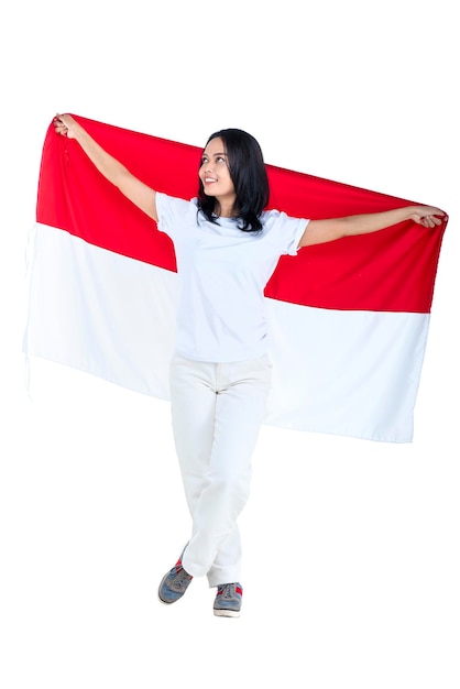 Indonesian women celebrate Indonesian independence day on 17 August by holding the Indonesian flag