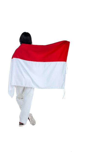 Indonesian women celebrate Indonesian independence day on 17 August by holding the Indonesian flag