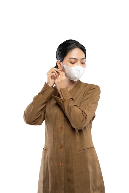 Indonesian women in civil servant uniforms wearing masks