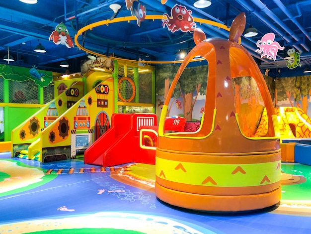 Indoor modern colorful children playground Inside kids playground with slides Kids entertainment