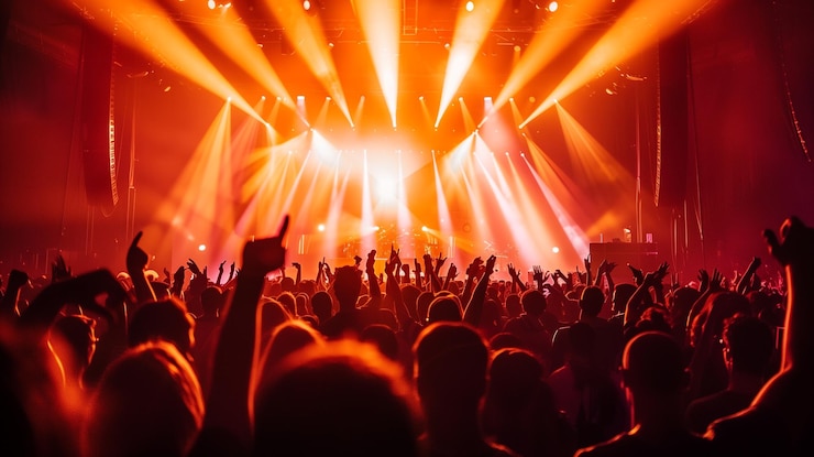Photo indoor night club party crowd with red orange spotlight