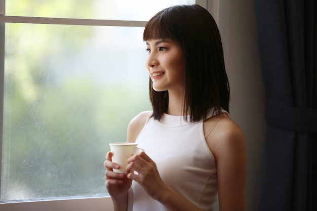 Indoor portrait of beautiful young woman posed at home