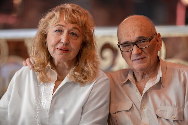 Indoor portrait of senior family couple