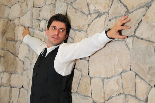 Indoor portrait of young and happy  businessman