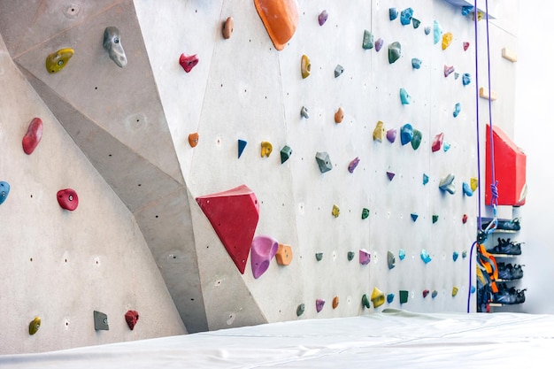 Indoor rock climbing simulation wall for mountaineering or mountain climber training, sport activity concept