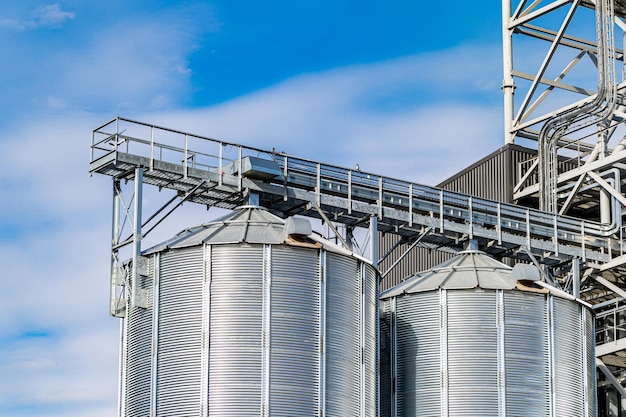 Industrial agriculture elevators with harvested grain. Grain cooperative. Closeup.