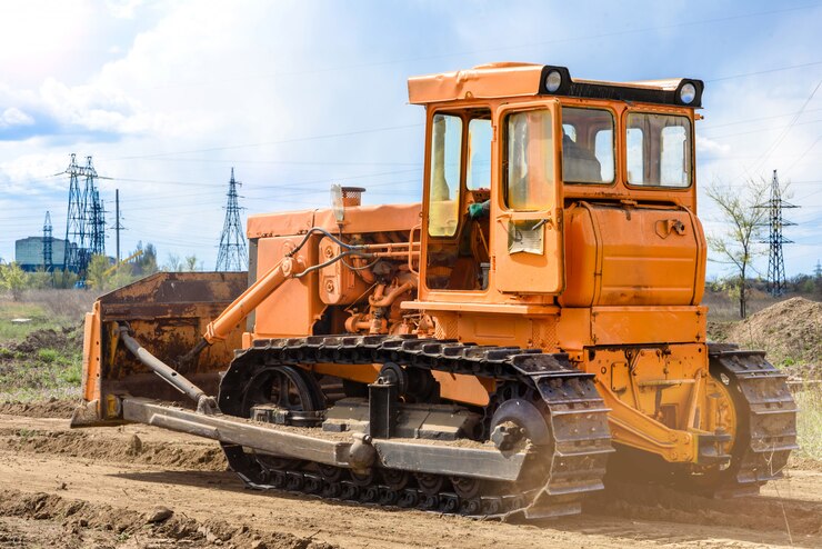 Photo industrial building construction site bulldozer leveling and moving soil during highway building. yellow bulldozer at a loamy construction site