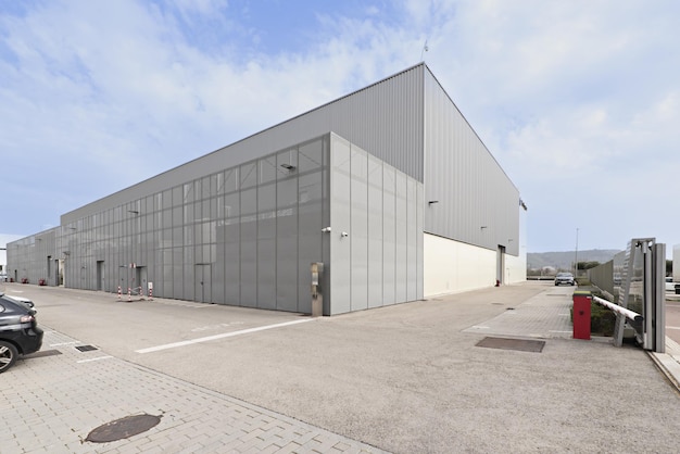 Industrial building facade with outdoor parking spaces