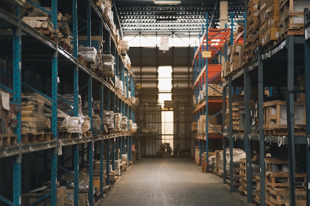 Industrial business warehouse storage of retail shop Warehouse interior with shelves rack for keep production material pallets and boxes Empty warehouse full of cargo Industrial concept