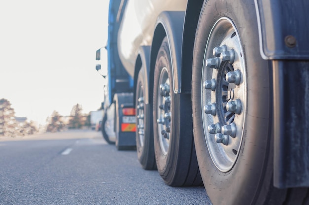 Industrial cargo transportation closeup of rear wheel of truck\
rear view with space for text