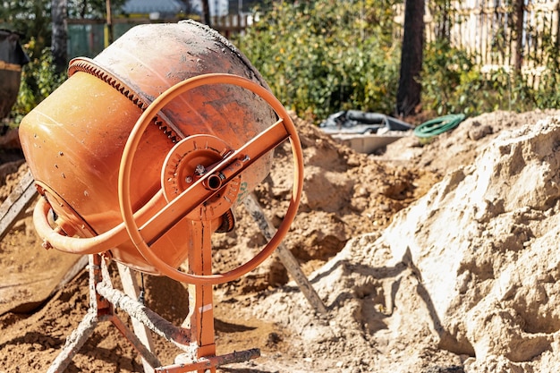 Industrial concrete mixer at a construction site Mixing concrete and mortar on site Construction equipment