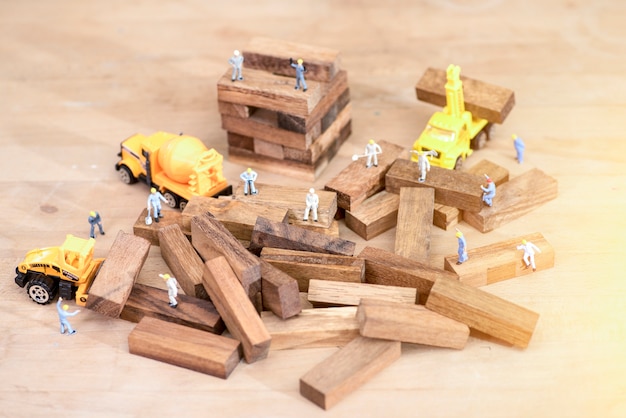 Industrial and construction concepts with miniature workers