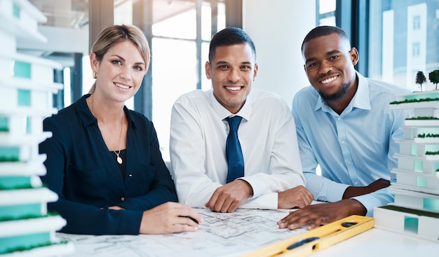 Industrial design development and diverse engineers working on an innovative project as a team Portrait of multiracial expert and professional industry workers analyzing a construction drawing