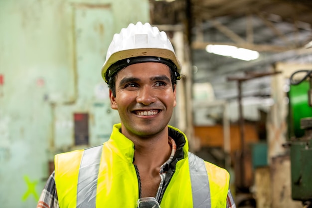 Industrial Engineers in Hard Hats.Work at the Heavy Industry Manufacturing Factory.industrial worker indoors in factory.aged man working in an industrial