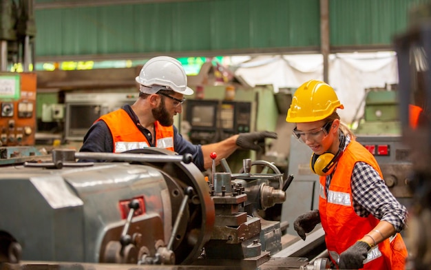 Industrial Engineers in Hard Hats.Work at the Heavy Industry Manufacturing Factory.industrial worker indoors in factory.aged man working in an industrial