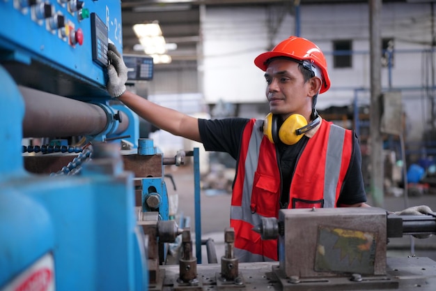 Industrial Engineers in Hard HatsWork at the Heavy Industry Manufacturing Factoryindustrial worker indoors in factory man working in an industrial factory