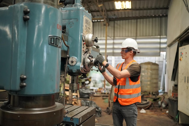 Industrial Engineers in Hard HatsWork at the Heavy Industry Manufacturing Factoryindustrial worker indoors in factory man working in an industrial factory