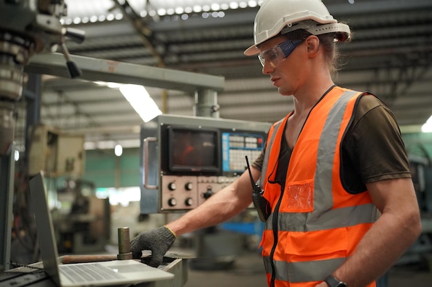 Industrial Engineers in Hard HatsWork at the Heavy Industry Manufacturing Factoryindustrial worker indoors in factory man working in an industrial factory