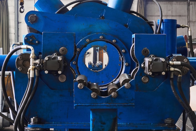 Industrial interior with steady rest of long lathe in the foreground