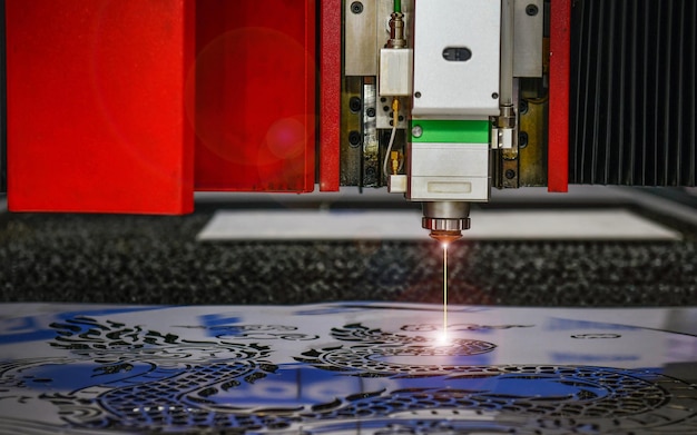 Photo industrial laser cut machine while cutting thensheet metal