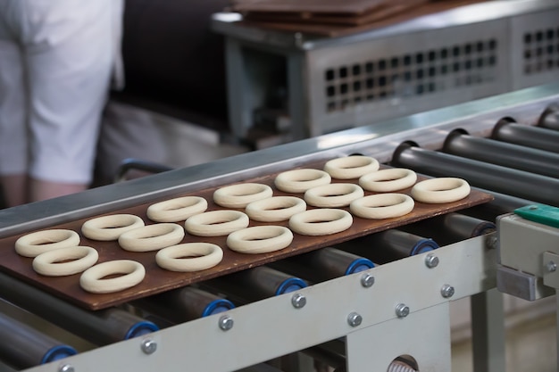 Industrial line for the production of biscuits and bagels. Conveyor belt for the production of culinary products