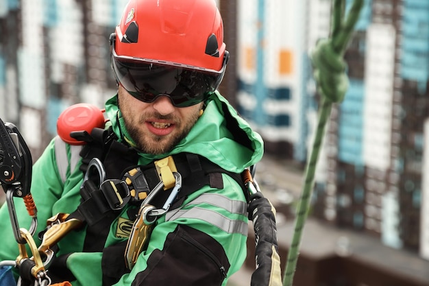 Industrial mountaineering worker during high rise work