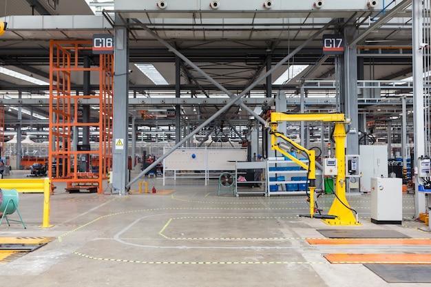 Industrial Picking Robot at Work. Interior of plant warehouse: industrial picking robot at work, no people