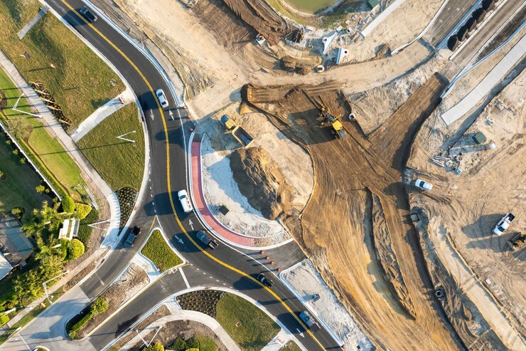 工業用道路工事 建設中の広いアメリカの高速道路のラウンドアバウト 迅速な輸送のための輸送システムの開発