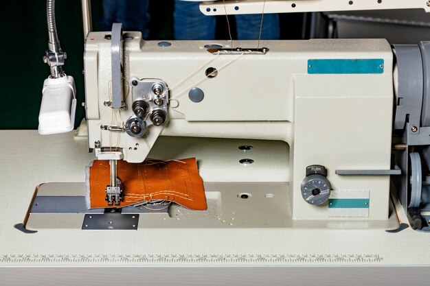 Industrial sewing machine for the manufacture of furniture upholstery from leather