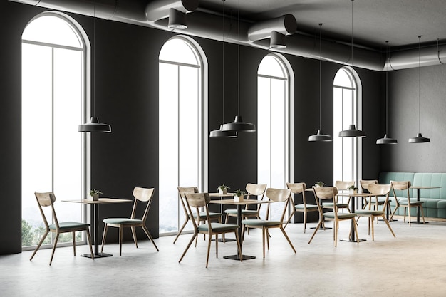 Industrial style cafe corner with dark gray walls, a concrete floor, arched windows and wooden tables with chairs. Green sofas. 3d rendering mock up