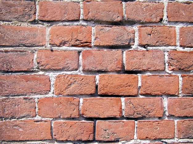 Foto fondo rosso del muro di mattoni di stile industriale