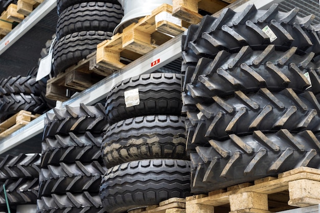 Photo industrial warehouse of spare parts on the shelves are many tires