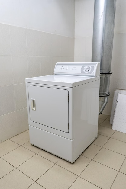 Industrial washing machine in the laundry room