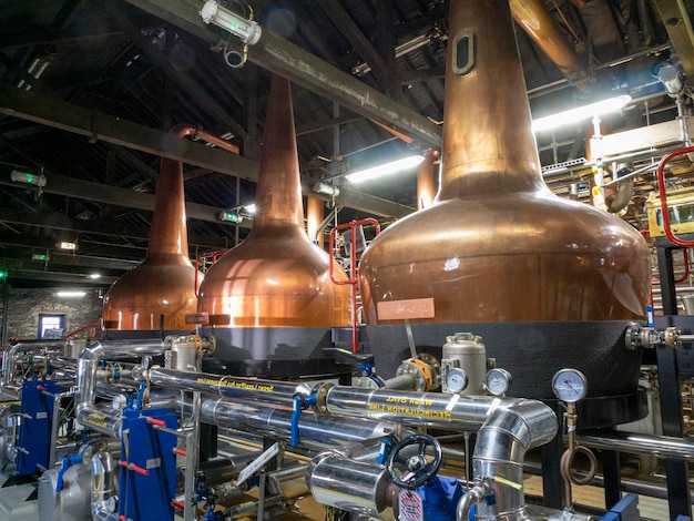 Industrial whiskey distiller construction alcohol production factory interior background