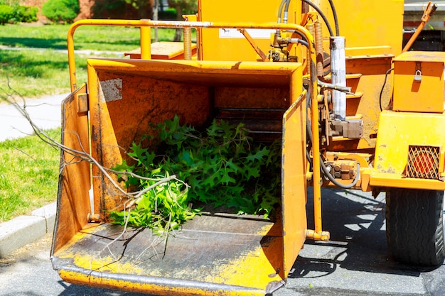 An industrial wood chipper at work