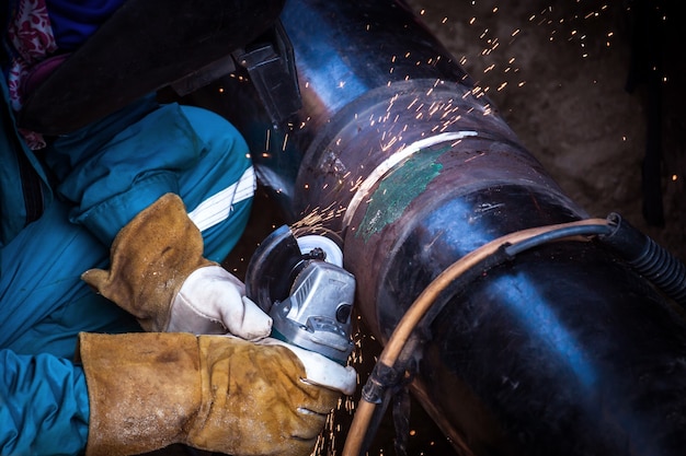 Industrial Worker at the factory welding closeup