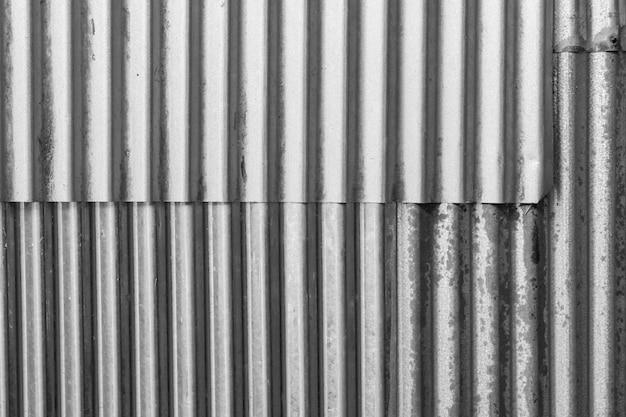 Foto industriële roestige achtergrond oude grunge roestige zinken muur voor gestructureerde achtergrond oude roestige gegalvaniseerde roest en gekrast stalen textuur golfplaten gevelbeplating vintage achtergrond