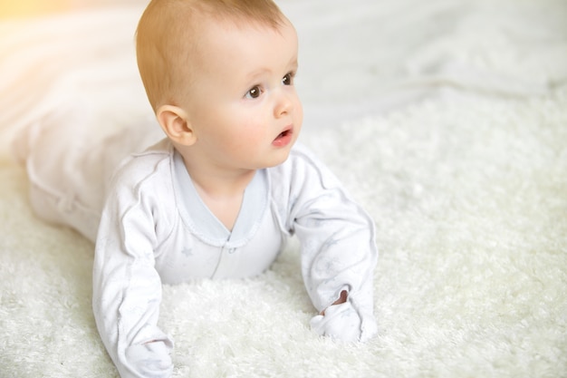Infant baby boy crawl with towel
