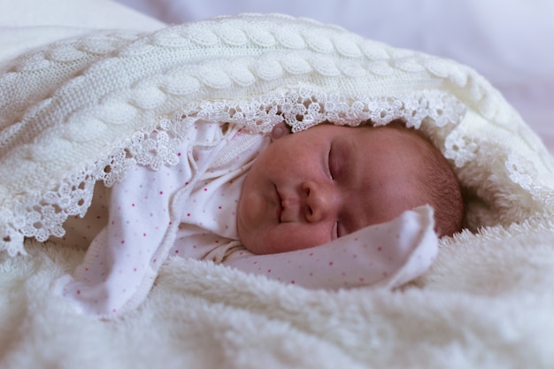 Infant baby portrait in white